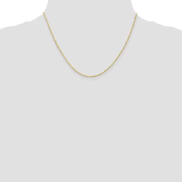 A thin gold-toned chain necklace displayed on a mannequin bust against a white background.