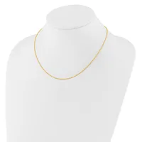 A thin gold-toned chain necklace displayed on a white mannequin bust.