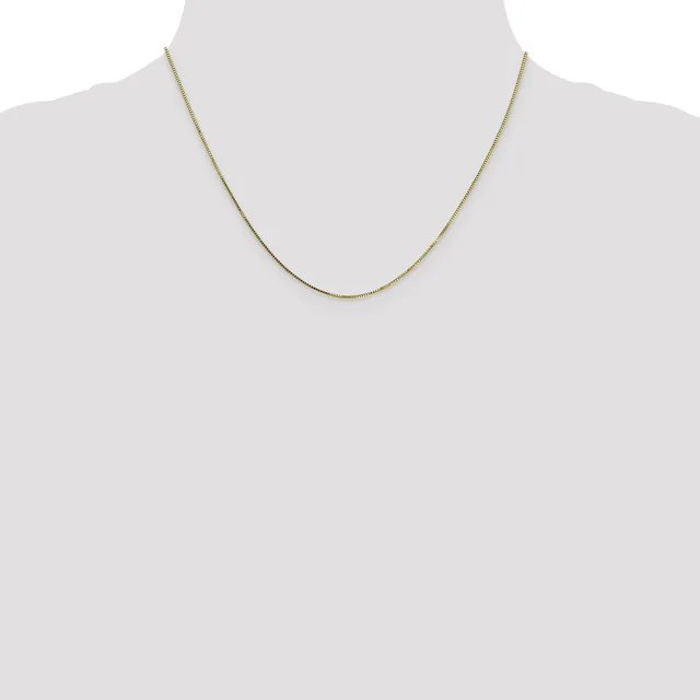 A thin gold-toned chain necklace displayed on a mannequin neck form against a white background.