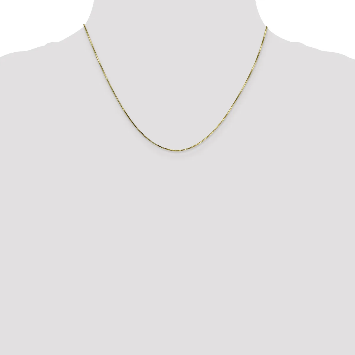 A thin gold-toned chain necklace displayed on a mannequin neck form against a white background.