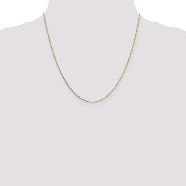 A thin gold-toned chain necklace displayed on a dress form mannequin against a white background.