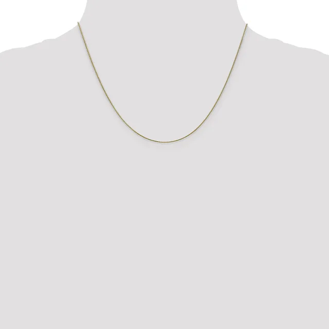 A thin gold-toned snake chain necklace displayed on a mannequin bust against a white background.