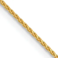 A thin gold chain with a twisted or braided texture running diagonally across a white background.