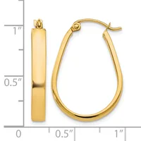 A pair of polished yellow gold teardrop-shaped hoop earrings with hinged posts, displayed against a measurement scale showing approximately one inch in height.