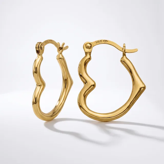 A pair of gold twisted hoop earrings with hinged closures, displayed against a white background with subtle shadows.
