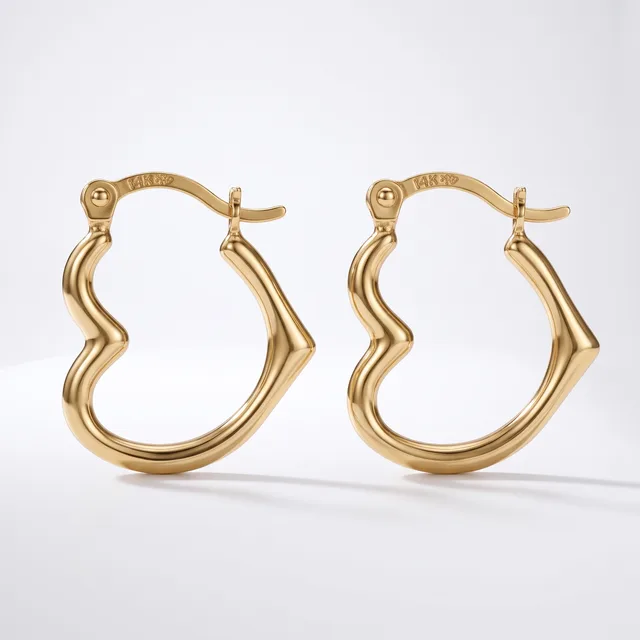 A pair of gold-toned hoop earrings with a wavy, curved design and hinged posts, displayed against a white background.
