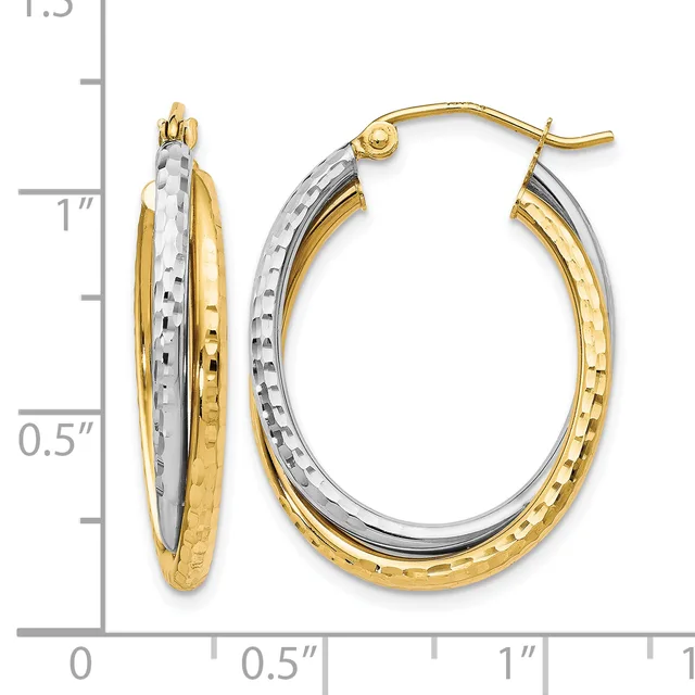 Two-tone gold oval hoop earrings with textured surfaces, shown next to a measurement scale indicating approximately one inch in length.