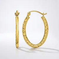 A pair of gold hoop earrings with textured quilted surface, shown from front and side view against a white background.