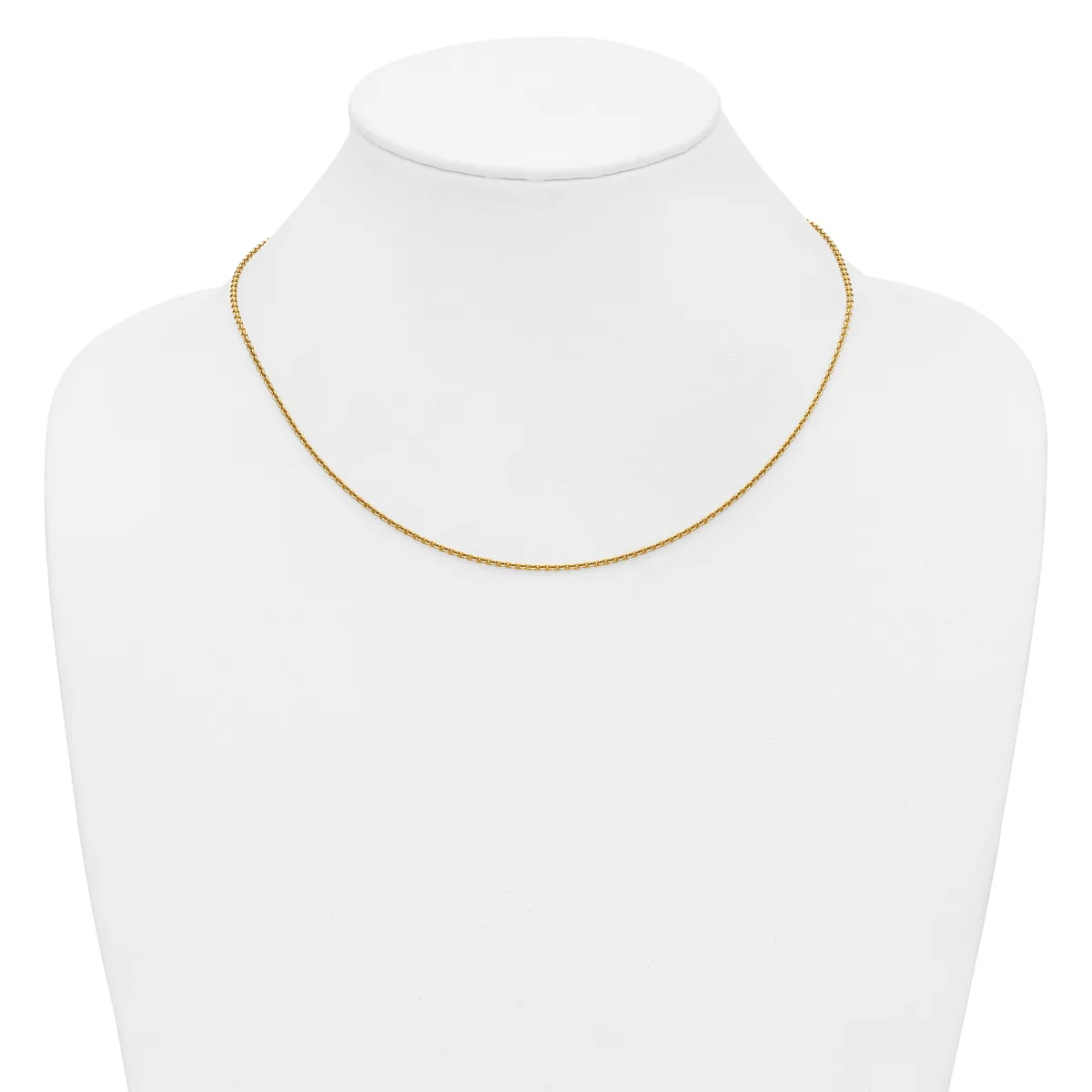 A delicate gold-toned chain necklace displayed on a white mannequin bust.