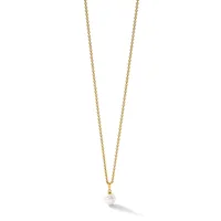 Gold chain necklace with a small white pearl pendant hanging from a gold bail.