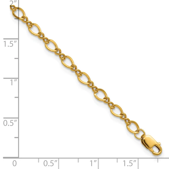 Gold-toned oval link chain with lobster clasp, displayed against a ruler showing approximately 2 inches in length.