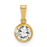 A gold pendant with a round bezel setting holding a clear faceted cubic zirconia or diamond simulant, suspended from a rectangular bail.