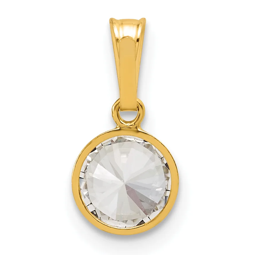 A gold pendant featuring a round faceted clear crystal stone set in a bezel setting, suspended from a polished gold bail.
