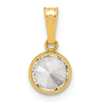 A gold pendant featuring a round faceted clear crystal stone set in a bezel setting, suspended from a polished gold bail.