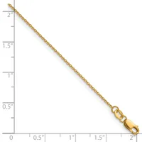 A gold chain necklace with a lobster clasp, displayed against a ruler showing its length of approximately two inches.