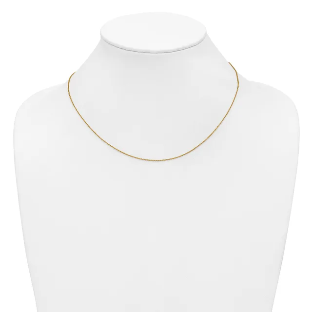 A thin gold-toned chain necklace displayed on a white mannequin bust.