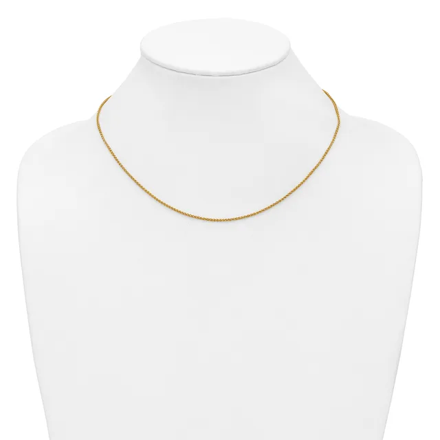 A delicate gold-toned chain necklace displayed on a white mannequin bust.
