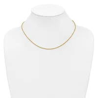 A delicate gold-toned chain necklace displayed on a white mannequin bust.