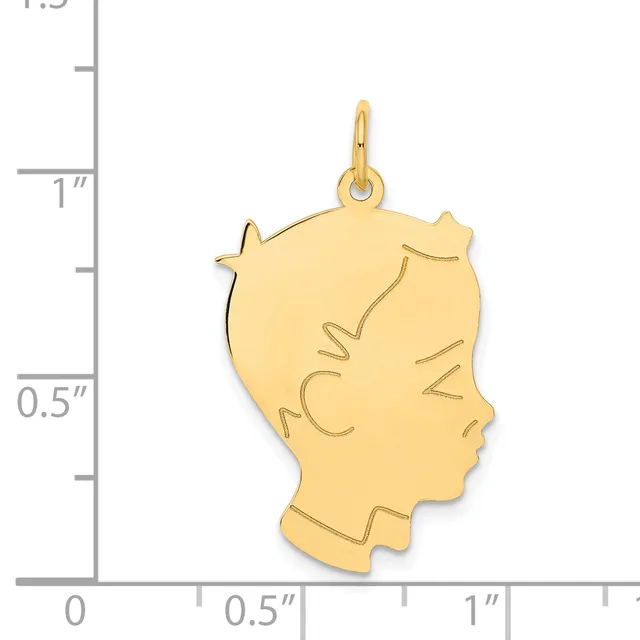 Gold-colored profile pendant of a woman's head with decorative line details, shown next to a measurement scale indicating approximately one inch in height.
