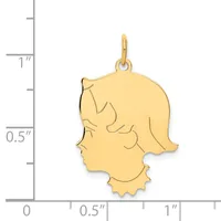 Gold pendant featuring a girl's profile silhouette with wavy hair and decorative collar detail, shown next to a measurement scale.