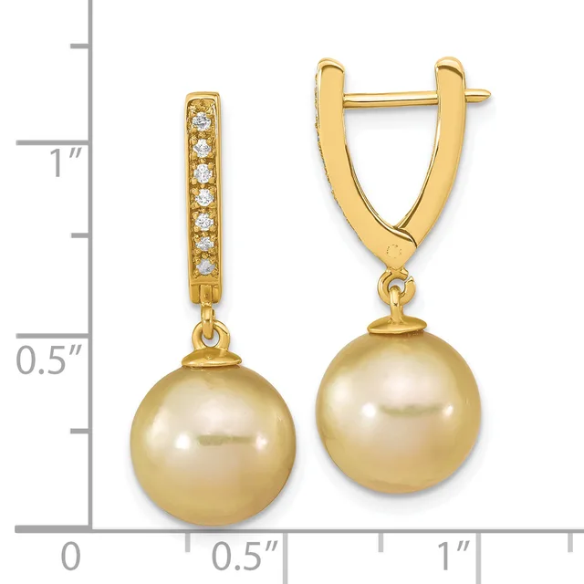 Gold-toned leverback earrings with diamond-set posts and dangling golden pearl spheres, displayed against a measurement scale.