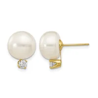 Pair of gold stud earrings featuring round white pearls with small round diamond accents below each pearl.