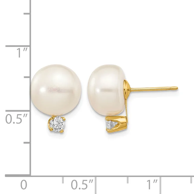 A pair of gold stud earrings featuring round white pearls with small diamond accents below, displayed next to a measurement ruler.
