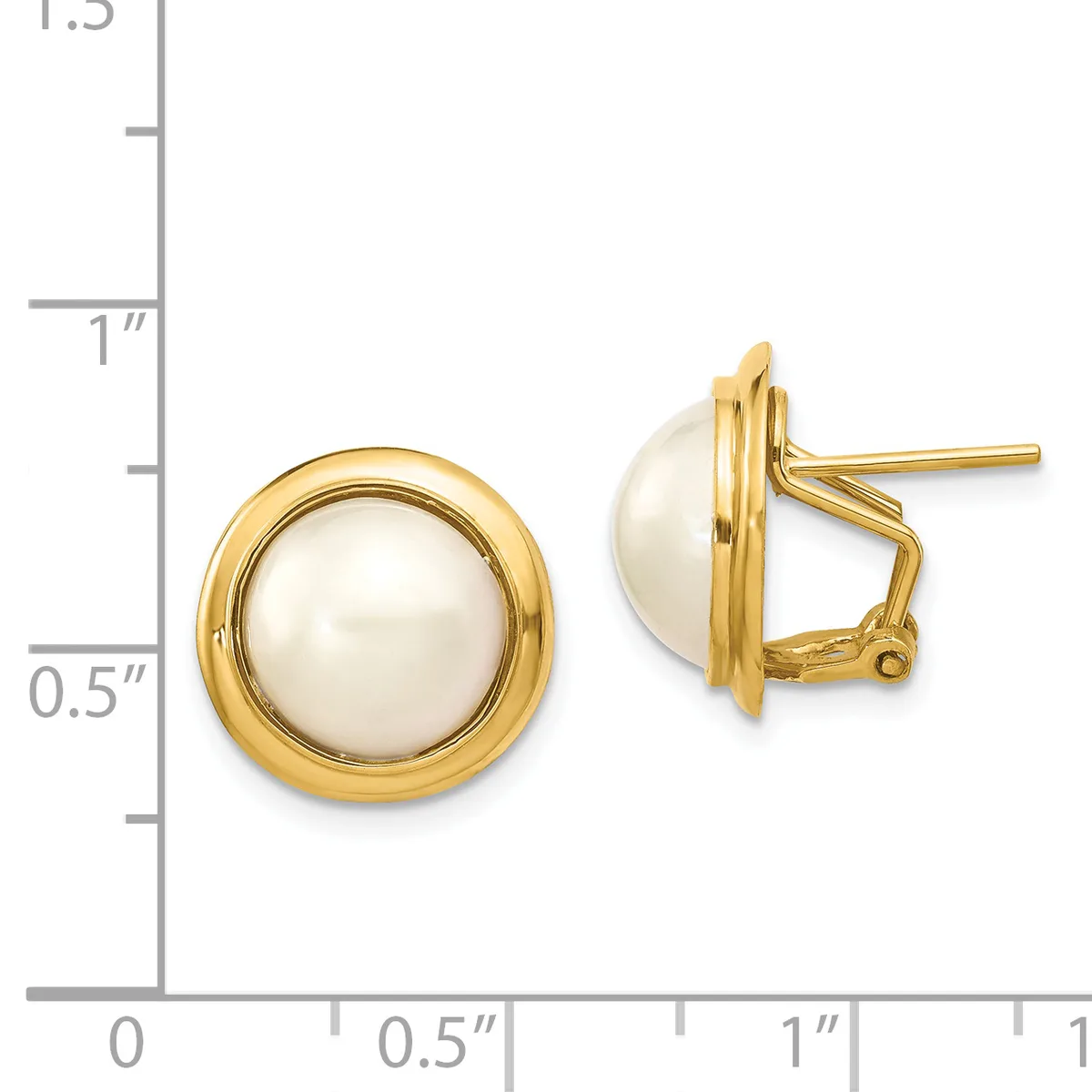 A pair of gold-toned stud earrings with white pearl centers and omega backs, displayed next to a ruler showing approximately one inch in diameter.