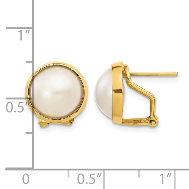 Pair of gold-toned earrings with white pearl cabochons set in circular bezels, shown front and side views against a measurement scale.