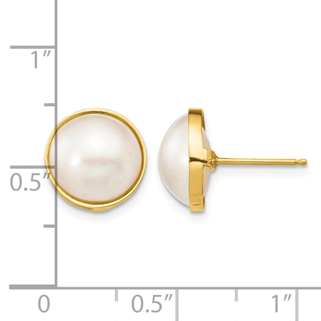 Pair of round white pearl stud earrings set in gold-tone metal, shown from front and side views next to a measurement scale.