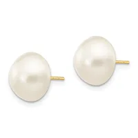 A pair of white pearl stud earrings with gold posts, displayed against a white background.