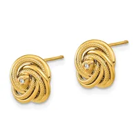 A pair of gold stud earrings with interlocking knot designs and small diamond accents, shown from the front against a white background.