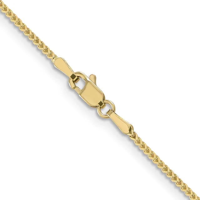 A gold chain necklace with a lobster clasp, shown diagonally against a white background.