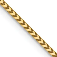 A gold-colored chain with a textured diamond or chevron pattern running diagonally across a white background.