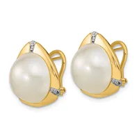 A pair of gold clip-on earrings, each featuring a large white pearl set in a polished gold frame with small diamond accents at the top and bottom.