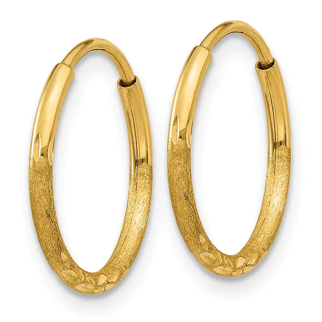 A pair of gold hoop earrings with a textured lower half and polished upper half, displayed against a white background.