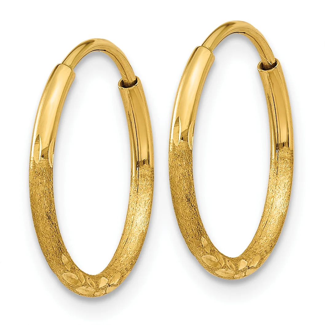 A pair of gold hoop earrings with a textured lower half and polished upper half, displayed against a white background.