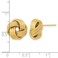 Gold knot stud earrings with textured and polished surfaces shown next to a measurement scale indicating approximately half-inch diameter.