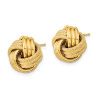 A pair of gold knot stud earrings with textured and polished surfaces, shown from the front against a white background.