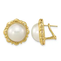 Pair of gold-toned earrings with white pearl centers surrounded by ornate scalloped frames, shown from front and side views.