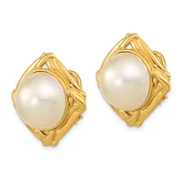 Pair of gold-toned stud earrings featuring oval white pearls set in ornate textured gold frames with geometric detailing.