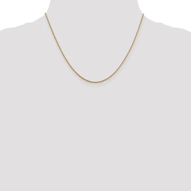A thin gold-toned chain necklace displayed on a dress form mannequin.