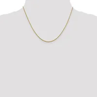 A thin gold-toned chain necklace displayed on a dress form mannequin.