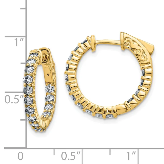 Gold hoop earrings with diamond accents arranged in a line pattern, shown next to a measurement scale indicating approximately one inch in length.