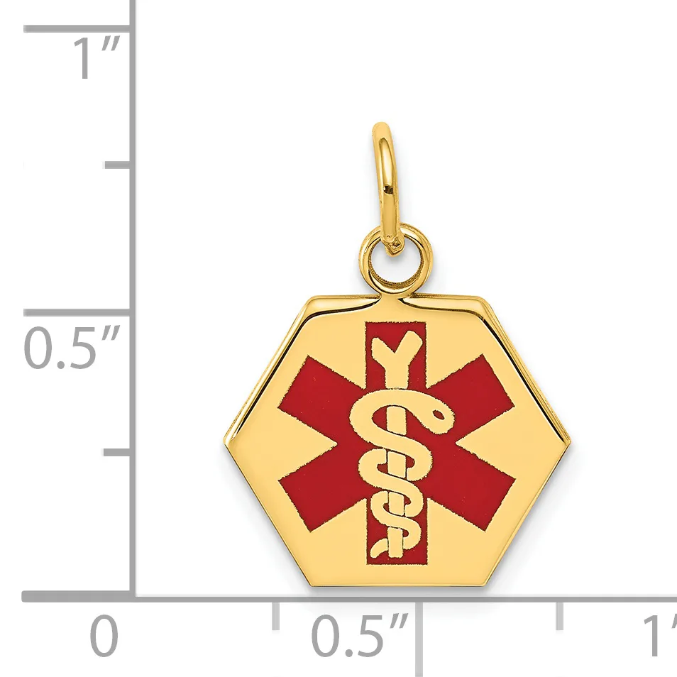 Gold hexagonal medical alert pendant with red enamel star of life symbol and golden serpent staff, shown next to a ruler measuring approximately 0.75 inches wide.