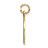 A long, slender gold pendant with a textured surface and a small circular loop attached at the top.