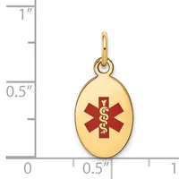 Gold-toned oval medical alert pendant with red enamel star of life symbol and caduceus, shown next to a ruler indicating approximately 0.75 inches in height.