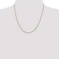 A thin gold-toned chain necklace displayed on a mannequin torso against a white background.