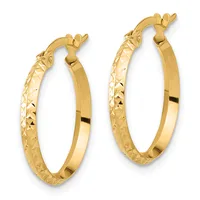 A pair of gold hoop earrings with textured surfaces on the outer edges and polished smooth inner surfaces, featuring hinged closures.