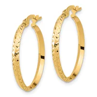 A pair of gold hoop earrings with diamond-cut texture on the outer surface and smooth polished finish on the inner surface, shown from above against a white background.